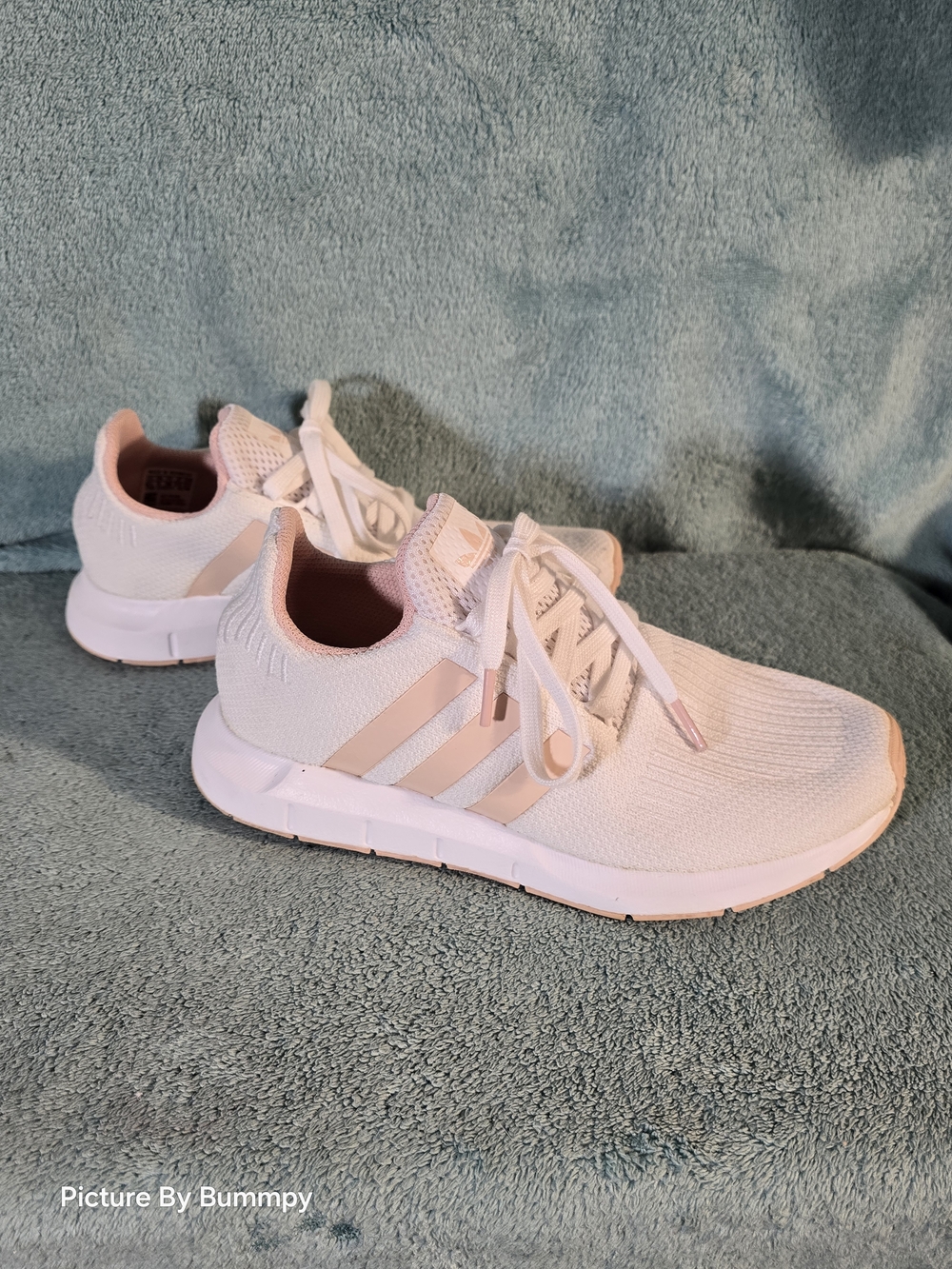 Adidas Swift Run 1.0. This specific colorway appears to be "White Vapour Pink"